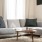 oversized windows brighten spacious, furnished living room